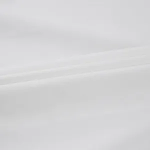 Close-up of soft white pure cotton fabric texture with natural folds