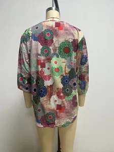 Back view of a colorful floral print casual blouse on a mannequin