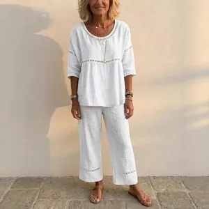 Elegant white linen-style two-piece set for women with hollow-out lace detailing