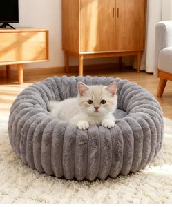 Detailed view of plush round grey cat bed with soft faux fur texture for small pets