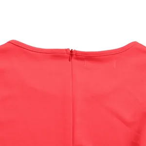 Close-up of the hidden back zipper and elegant neckline on a red office dress.