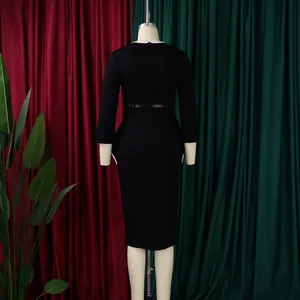 Detailed back view of an elegant black long-sleeve midi pencil dress with white trim