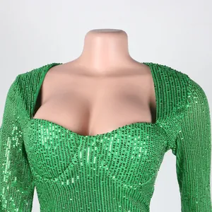 Close-up detail of a green sequined party dress with a stylish sweetheart neckline