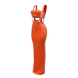 Side view of vibrant orange two-piece set featuring white piping and bodycon maxi skirt