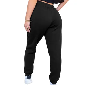 Back view of women's black high-waisted sweatpants showing fit and elastic cuffs.