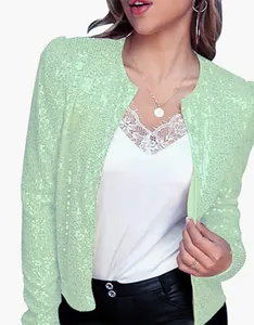 Macro view of mint green sequin short jacket showing fine sequin texture and fit