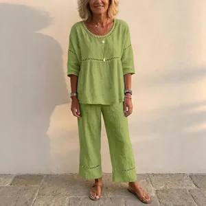 Elegant women's casual linen two-piece set featuring eyelet trim in vibrant lime green