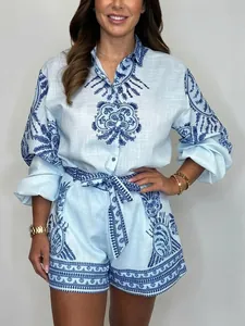Elegant light blue long sleeve shirt and shorts two-piece set with ethnic print