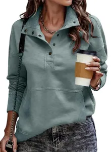 Detail of women's stand collar sweatshirt with button placket and ribbed texture in blue