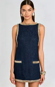 Front view of elegant sleeveless denim mini dress featuring gold beaded trim