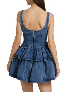 Back view of a blue tiered denim suspender mini dress with ruffled skirt and zipper detail