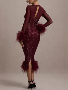 Elegant burgundy sequin party dress with long sleeves and luxurious feather trim details