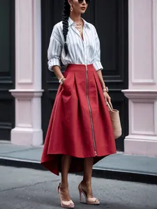 Full-length view of a red high-waist skirt with front zipper and asymmetrical hem