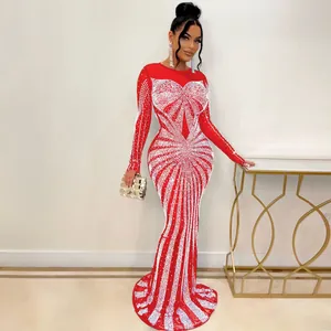Stunning floor-length red evening gown featuring intricate white rhinestone patterns and slim fit