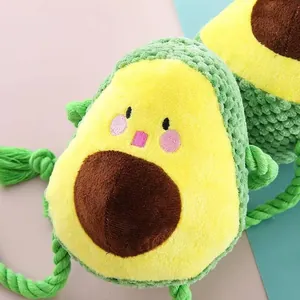 Detail shot showing the textured fabric and cotton rope legs of the avocado dog chew toy