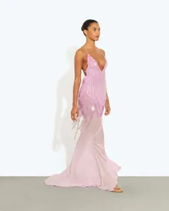 Side view of sequined pink mermaid evening dress with deep V-neck and backless design