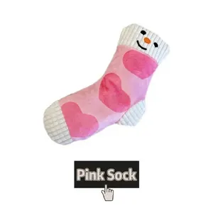 Macro detail of a pink plush pet toy sock featuring heart patterns and snowman face