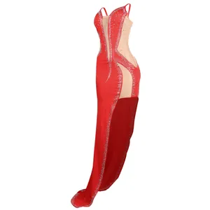 Detailed side view of a red evening gown featuring rhinestones and sheer mesh panels