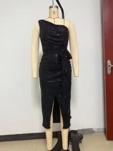 Full detail of a black one-shoulder sequin dress displayed on a studio mannequin.