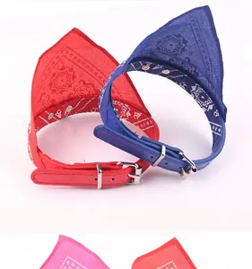 Detail shot of paisley print dog bandana collars in red and blue leather