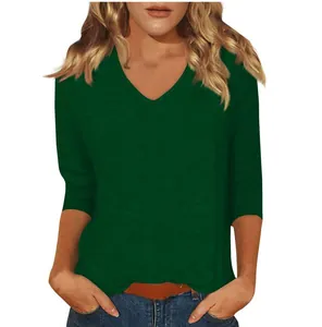 Detailed view of a dark green casual women's T-shirt featuring a classic V-neck and 3/4 sleeves