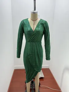 Dark green shimmery V-neck long-sleeve dress displayed on a tailor's mannequin