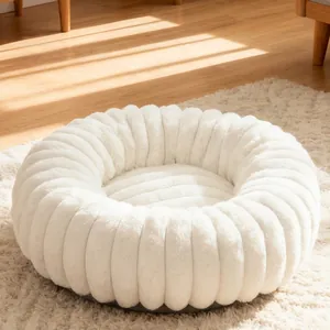 Warm round white plush pet bed with donut design for cats and small dogs