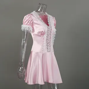 Side view detail of pink satin dress with delicate white lace trim and puff sleeves
