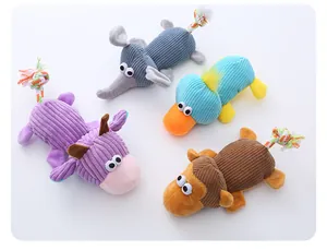 Detail view of colorful corduroy dog chew toys with braided rope tails
