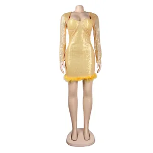 Detailed view of a gold sequined bodycon dress with feather hem trim