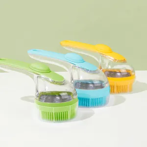 Set of three colorful pet bath brushes with built-in soap dispenser handles for grooming