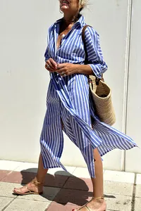 Elegant blue and white striped shirt dress with side slits and lapel collar detail