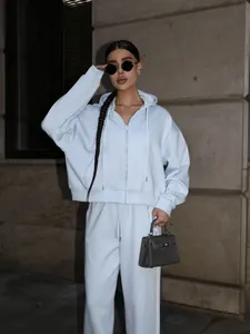 Stylish light blue two-piece cotton tracksuit featuring a zip-up hoodie and sweatpants.