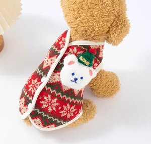 Close-up detail of a festive Christmas dog vest with plush bear appliqué and snowflake pattern