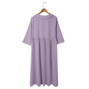 Back view of a purple cotton linen loose dress with a Peter Pan collar and gathered waist