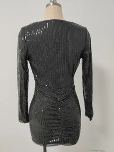 Detailed back view of an elegant black sequined long-sleeve dress with chic ruched texture