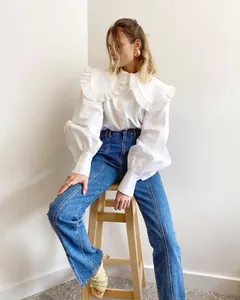 Stylish white cotton shirt with a large ruffled Peter Pan collar and puff sleeves.