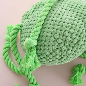 Detailed view of avocado plush dog toy with textured fleece and durable cotton rope