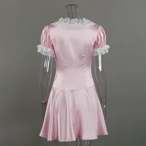 Back view of pink satin French lace dress with puff sleeves and A-line skirt