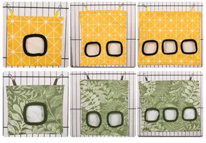 Hanging hay feeder bags for small pets featuring green leaf and yellow star patterns