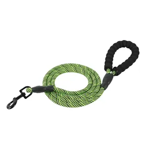 Detailed view of neon green and black braided dog leash with foam handle and metal hook