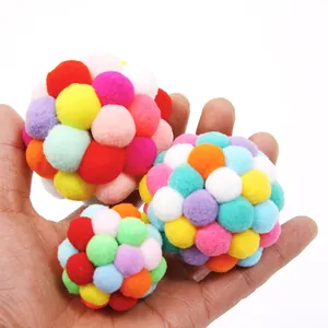 Set of three colorful plush pom-pom balls for interactive cat play and exercise