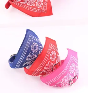 Detail of paisley print leather dog bandana collars in blue, red and pink colors