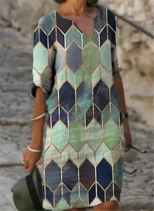 Vibrant geometric diamond print detail on a V-neck mid-sleeve vintage dress