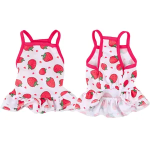 Detailed front and back view of a white pet dress with red strawberry patterns.