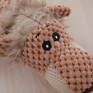 Close-up macro shot of durable plush dog chew toy featuring textured popcorn fabric