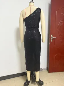 Detailed back view of a sparkling black one-shoulder sequin cocktail dress on a mannequin