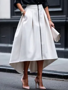 Elegant white high-waisted pleated skirt with front zipper and irregular hemline.
