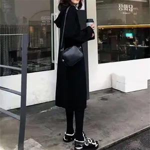 Cozy and elegant oversized black hooded knit sweater midi dress for women's autumn style