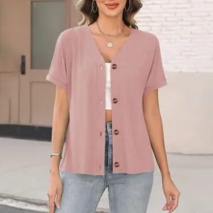 Detail view of pink V-neck button-down short sleeve top for women in casual style